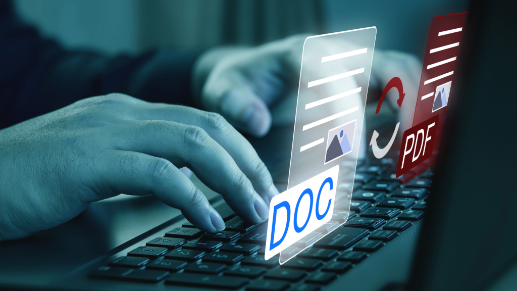 Hands typing at computer with icons of PDF and document files